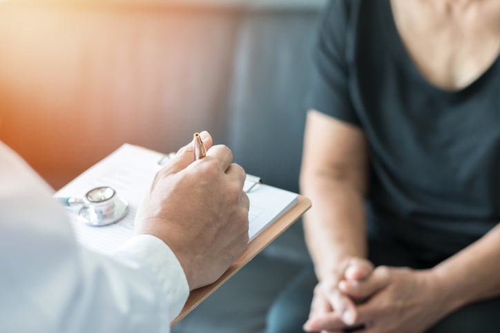 Doctor speaking with patient